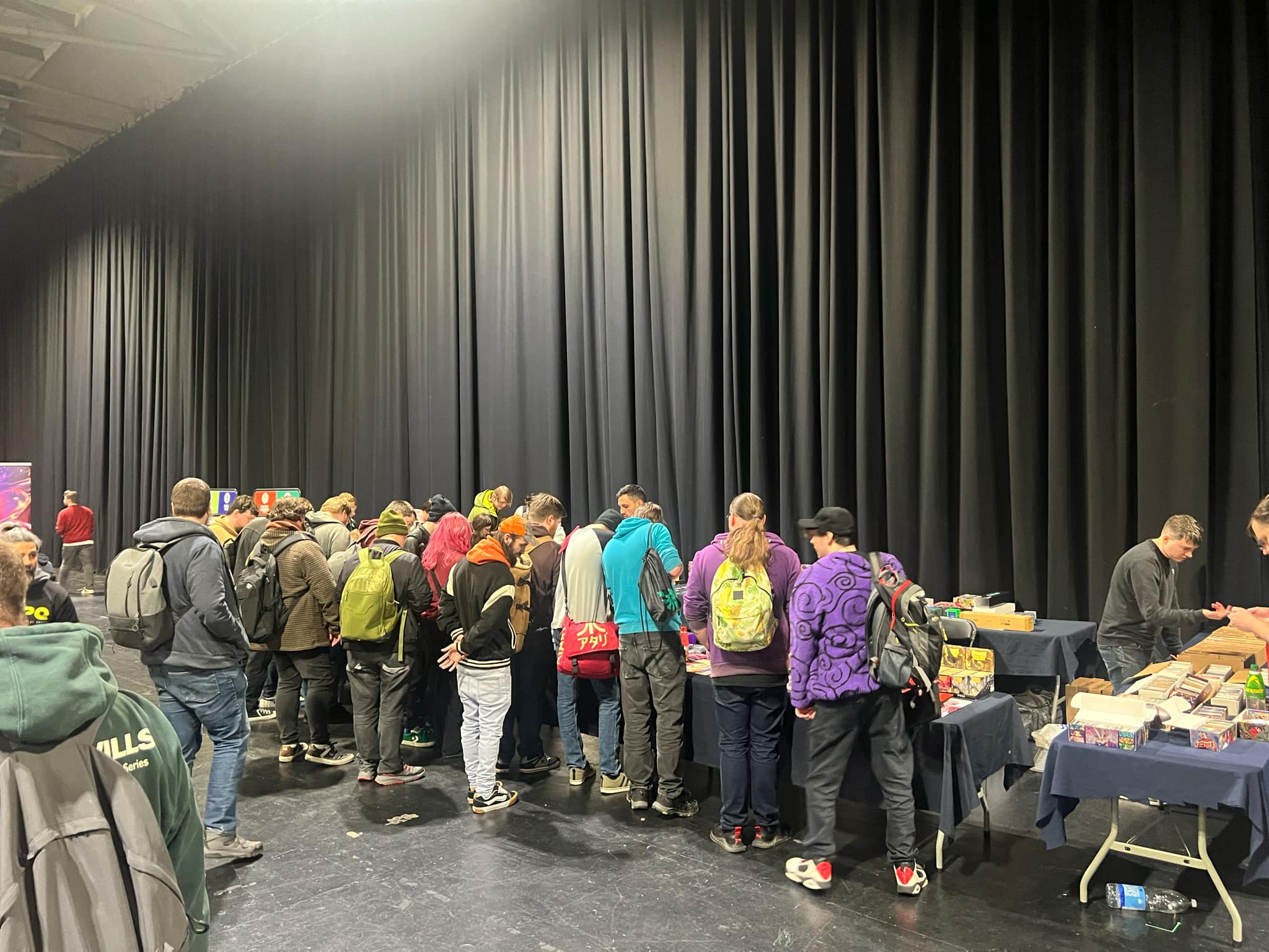 A crowd of people at the Tartarus TCG stall at a regional tournament at the SEC.